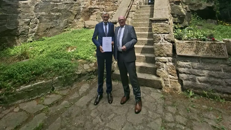 Li: Sachsens Innenminister Armin Schuster. Re: Bürgermeister Thomas Martolock